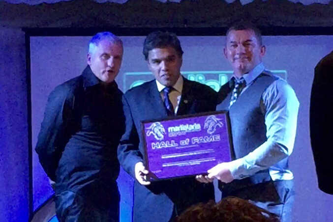 A student receiving a trophy